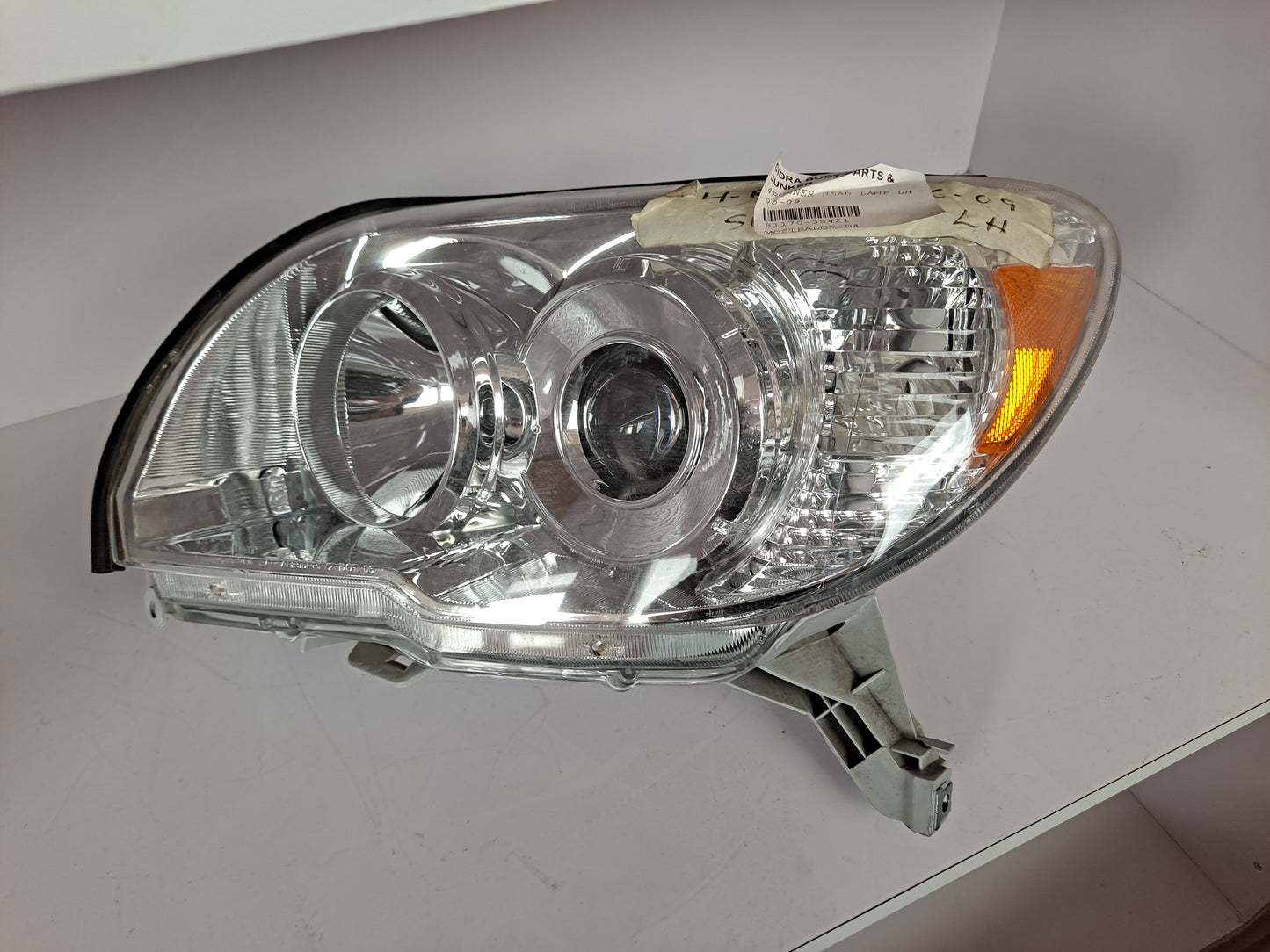 HEAD LAMP LH 4RUNNER 2006-2009 (LADO IZQUIERDO)