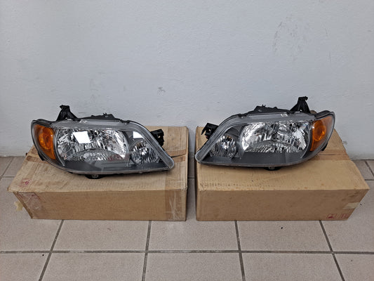 PROTEGE HEAD LAMPS SET 2001-2003 BLK - NUEVO / ORIGINAL