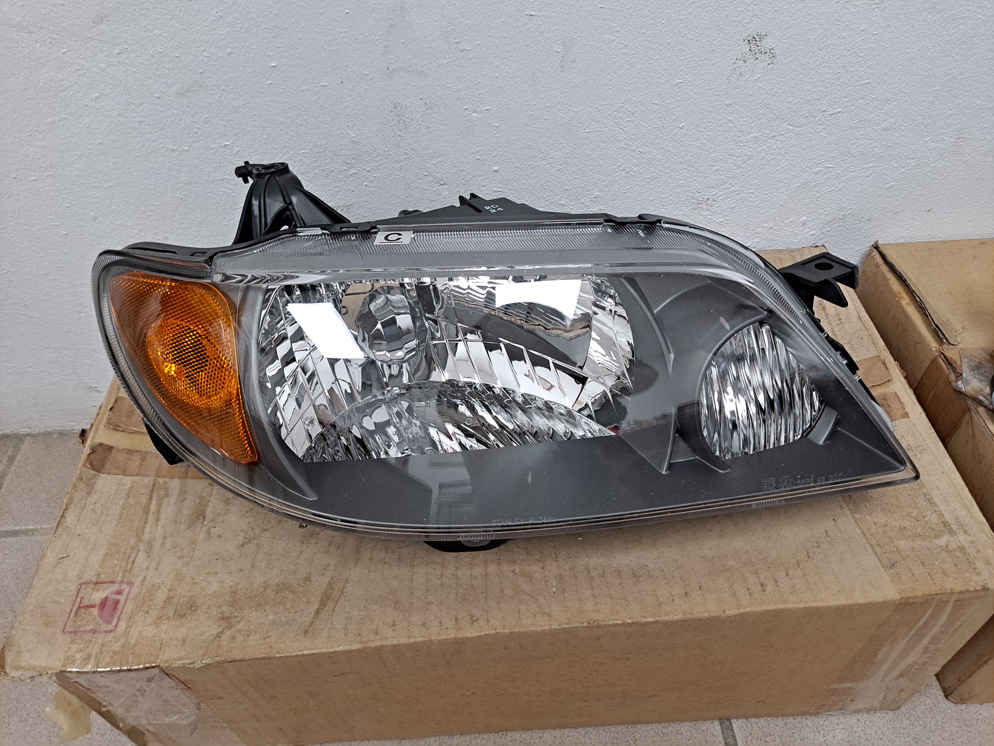 PROTEGE HEAD LAMPS SET 2001-2003 BLK - NUEVO / ORIGINAL