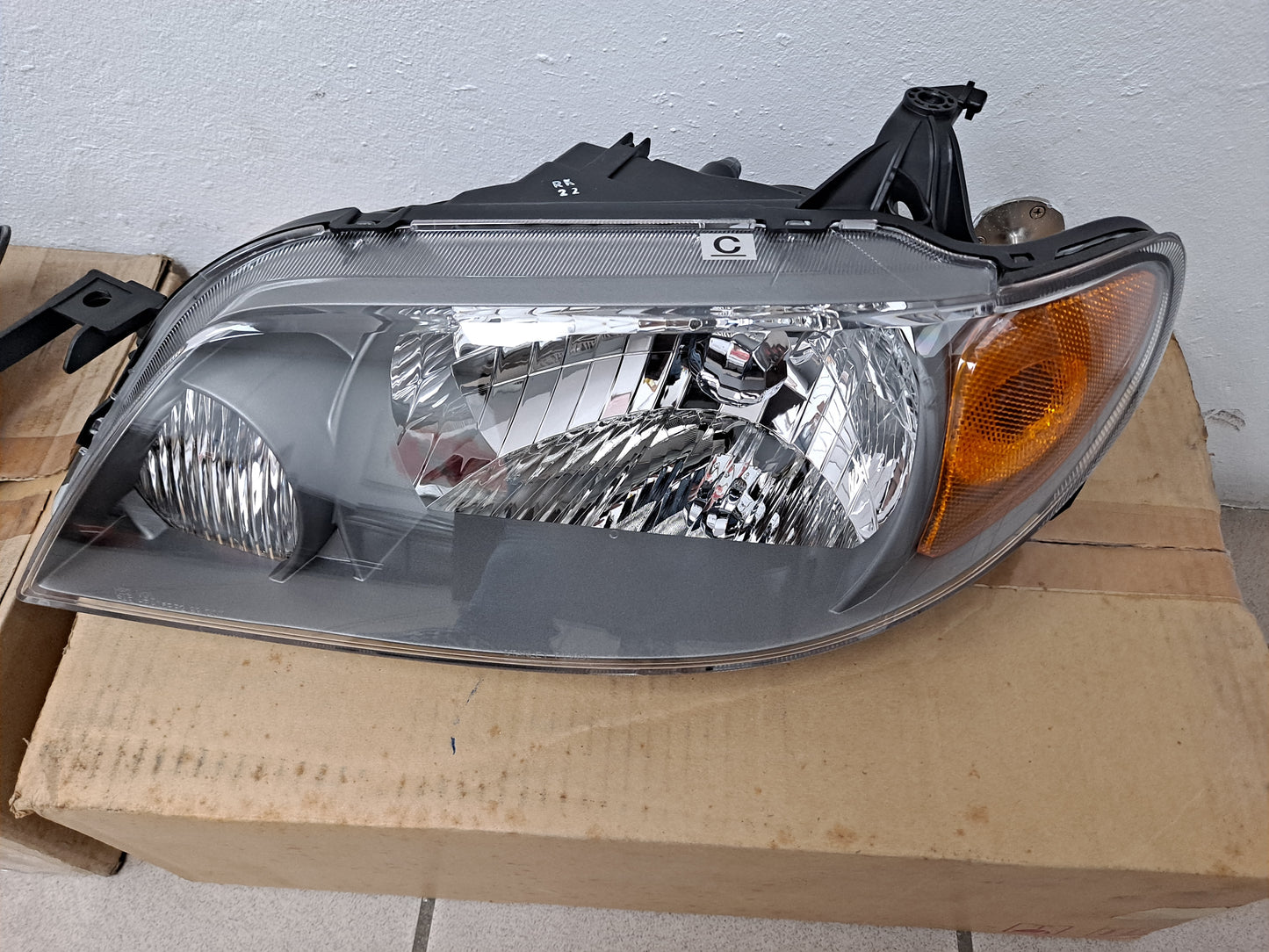 PROTEGE HEAD LAMPS SET 2001-2003 BLK - NUEVO / ORIGINAL